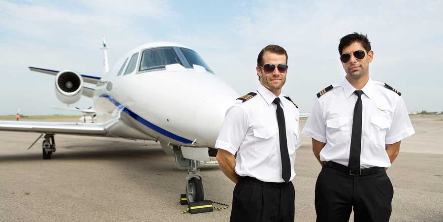 Pilots wearing sunglasses to protect their eyes from sunlight