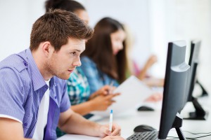 University student studying in front of a computer