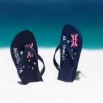 New to Australia. A pair of thongs in the sand