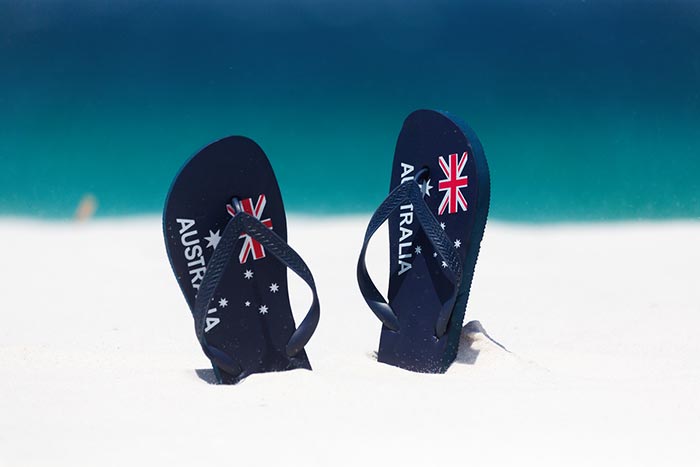 New to Australia. A pair of thongs in the sand