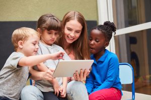 Child care worker engaging with children