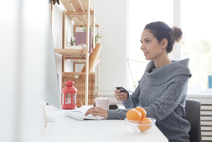 A property investor paying her investment property expenses online.