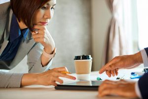 Couple checking their policies for loyalty tax.