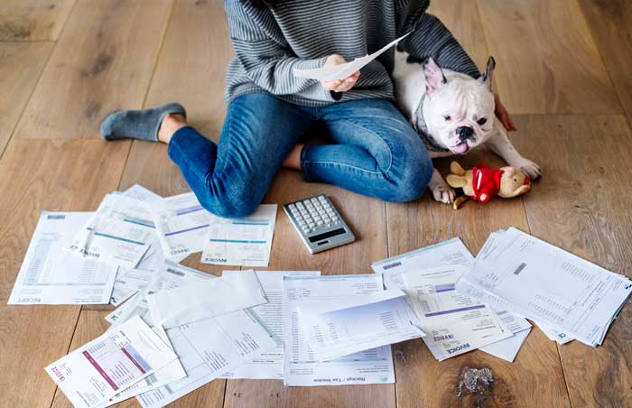 A girl surrounded by receipts who needs an amended tax return