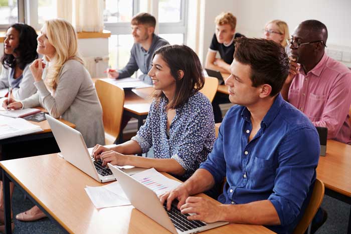 Classroom of adult students upskilling to help their job security.