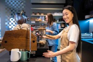 Two young workers in a coffee shop - who claim the tax free threshold