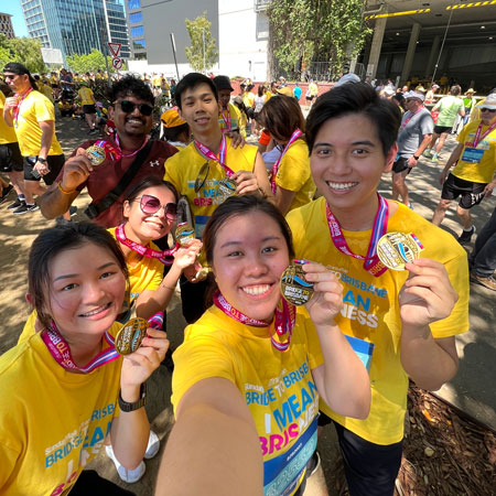 Etax employees finishing Bridge to Brisbane