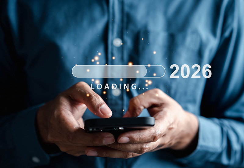2026 tax return loading. Man on phone with 2026 year